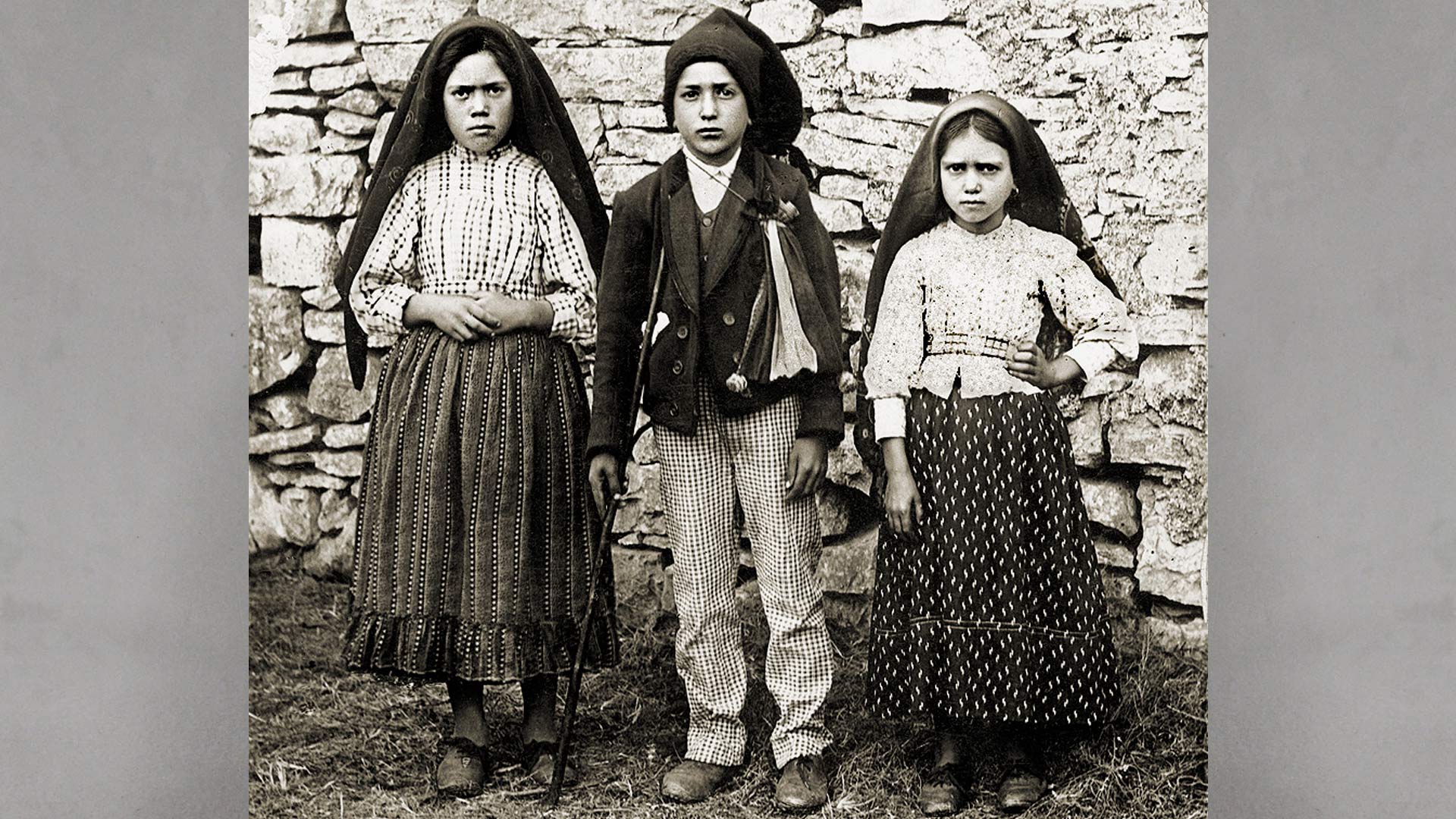 Historical photograph of Lucia de Santos and her cousins Francisca and Jacinta Marto, the Fatima visionaries, 1917