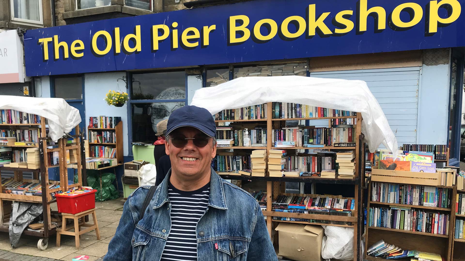 Paul Fillingham outside the Old Pier Bookshop on Morecambe Bay promenade