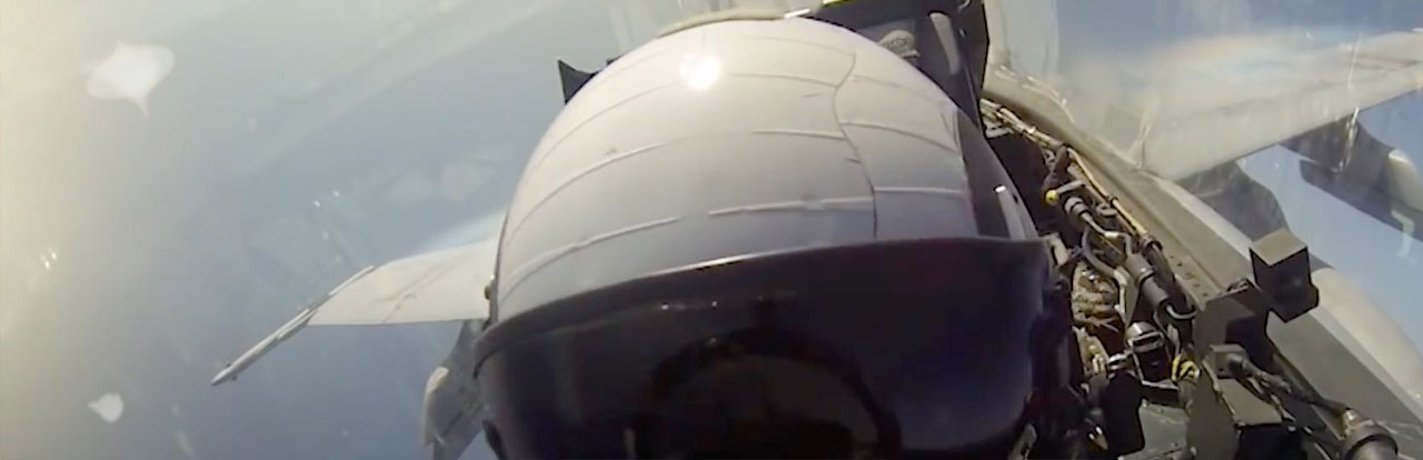 Fighter pilot cockpit view from inside a jet aircraft at altitude